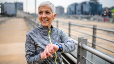 A person using a smartwatch while exercising.